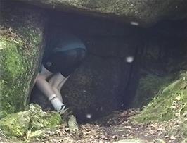 Tom follows the others into the cave